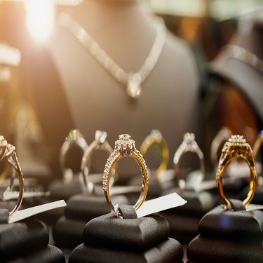 Graff D Flawless emerald cut diamond ring and high jewellery emerald cut diamond earrings worn by model